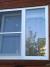 Фото 7. Пластиковое окно KLV Standart, двустворчатое в деревянном доме. Одна створка глухая, другая створка поворотно-откидная с москитной сеткой